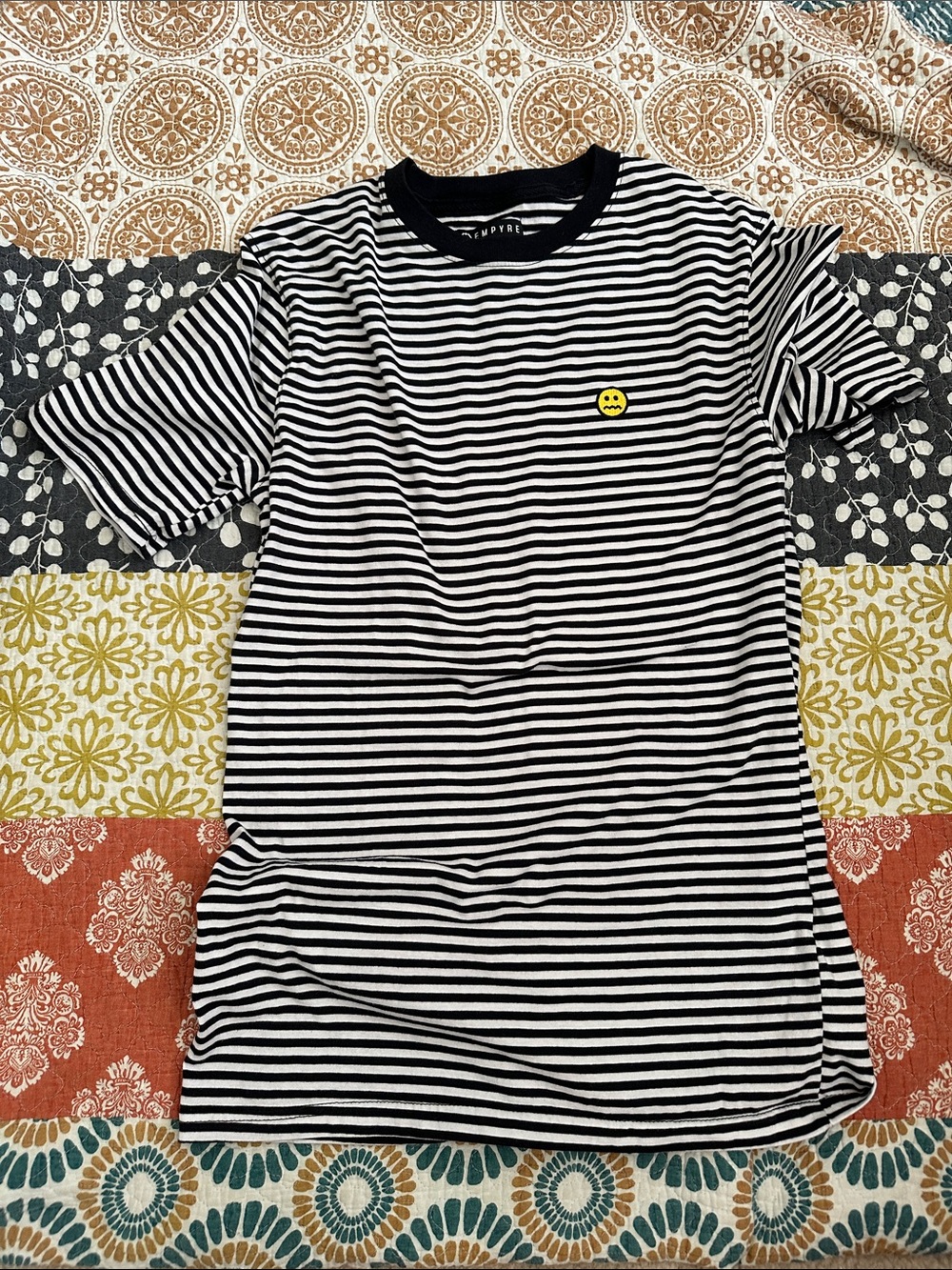 Empyre Black and White Striped Tee with Yellow Smiley Patch